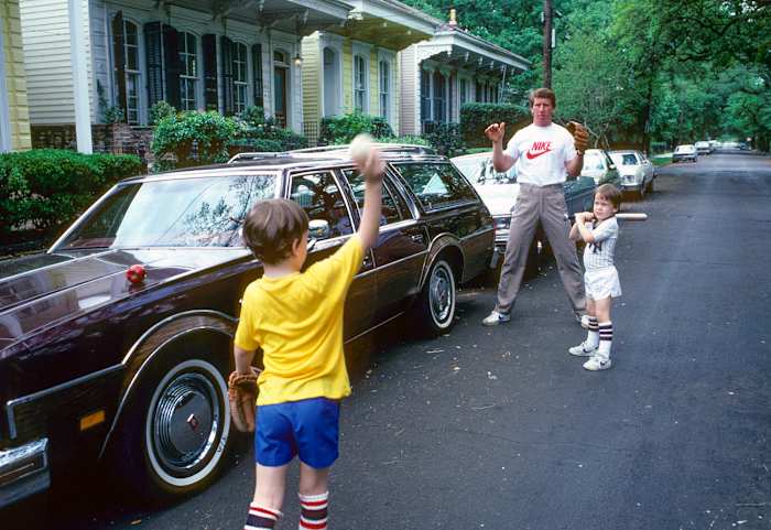 Playing ball with Cooper and Peyton, 1981.
